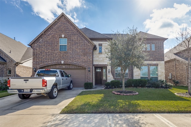 view of property featuring a front lawn and a garage