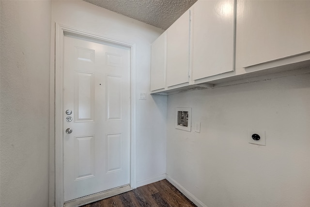 washroom featuring cabinets, hookup for a washing machine, hookup for an electric dryer, a textured ceiling, and dark hardwood / wood-style floors