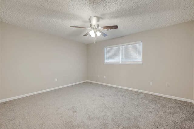 empty room featuring carpet flooring, a textured ceiling, and ceiling fan