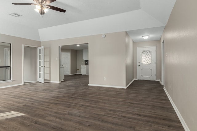 interior space featuring dark hardwood / wood-style floors, ceiling fan, and lofted ceiling