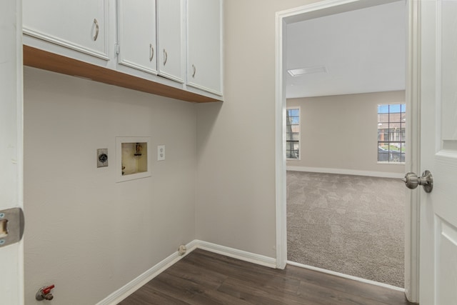 washroom featuring cabinets, washer hookup, hookup for an electric dryer, and dark wood-type flooring