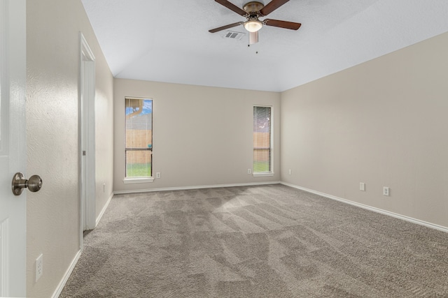 unfurnished room featuring light carpet, ceiling fan, and lofted ceiling