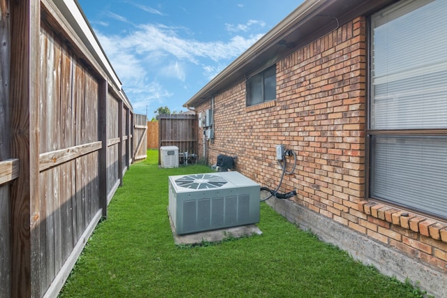 view of yard featuring central air condition unit