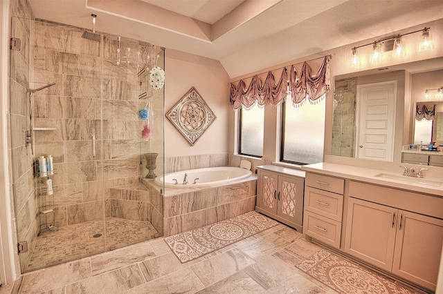 bathroom featuring shower with separate bathtub and vanity