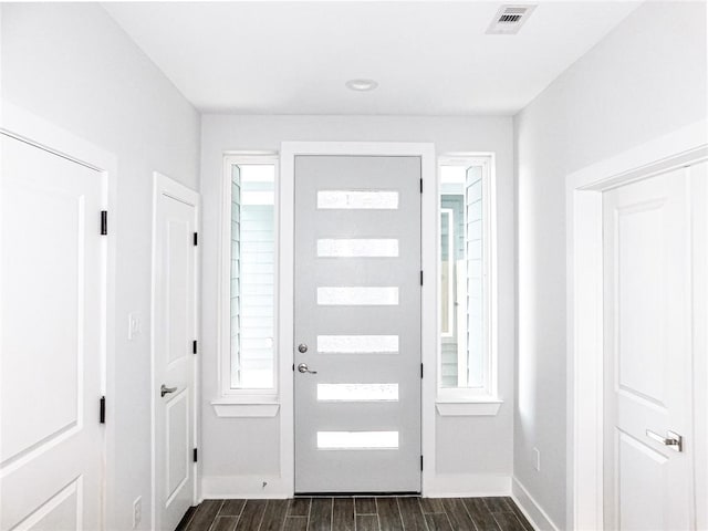 foyer entrance featuring dark hardwood / wood-style floors