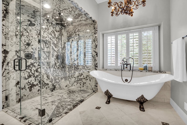 bathroom with tile patterned flooring, separate shower and tub, tile walls, and a notable chandelier