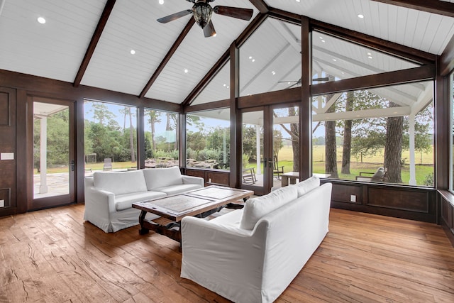 living room with beamed ceiling, light wood-type flooring, high vaulted ceiling, and ceiling fan