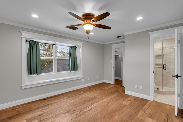 unfurnished bedroom with ensuite bath, ceiling fan, light hardwood / wood-style flooring, and crown molding