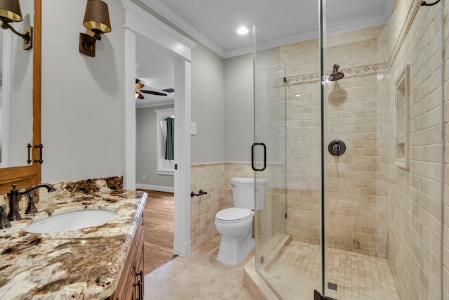 bathroom with walk in shower, crown molding, toilet, vanity, and hardwood / wood-style flooring