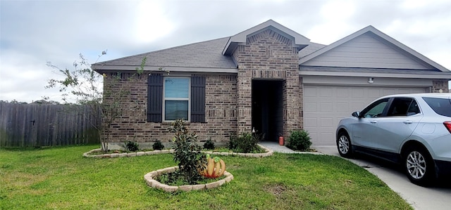 view of front of house with a front yard and a garage