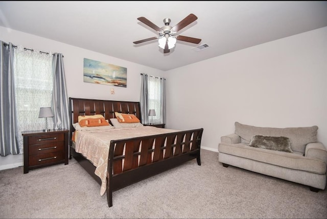 bedroom with light carpet and ceiling fan