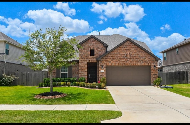 view of front of property with a garage and a front yard