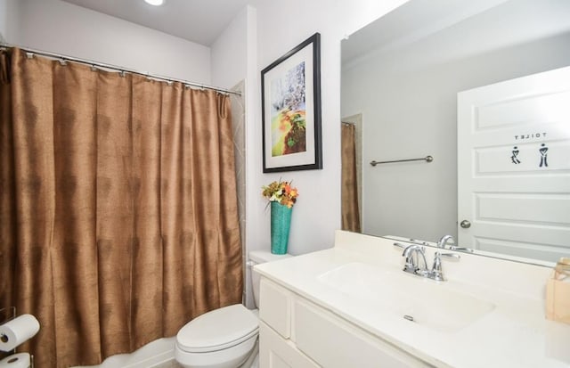 full bathroom with vanity, shower / bath combo, and toilet