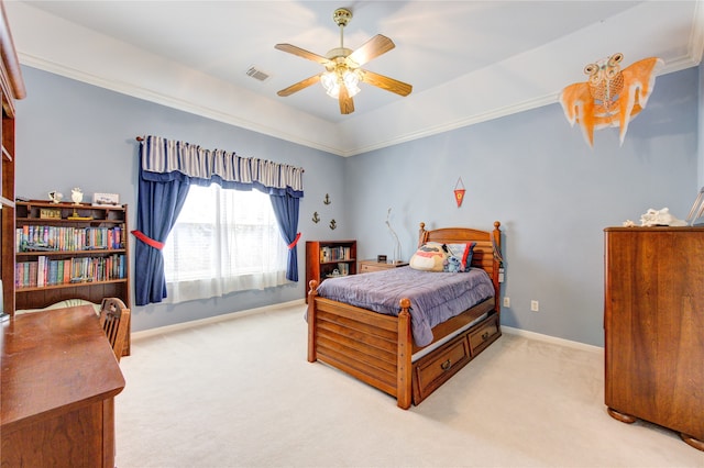 carpeted bedroom with ceiling fan and ornamental molding