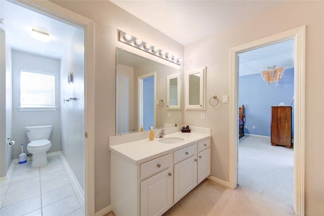 bathroom with tile patterned floors, vanity, and toilet