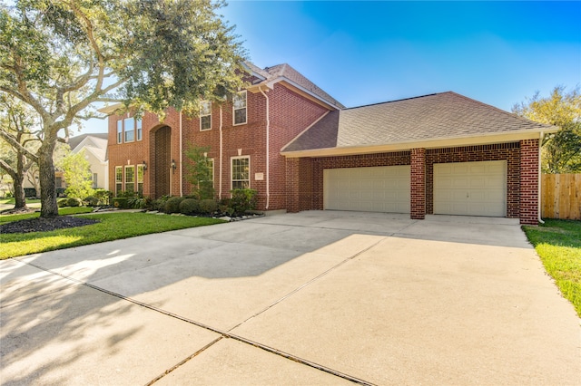 view of front facade with a front lawn and a garage