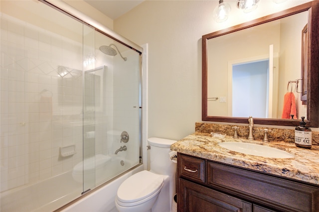 full bathroom featuring vanity, toilet, and enclosed tub / shower combo