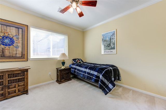 bedroom with carpet flooring, ceiling fan, and crown molding