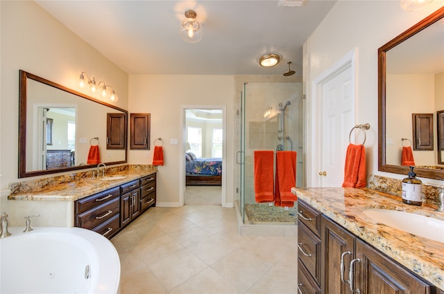 bathroom featuring tile patterned flooring, vanity, and an enclosed shower