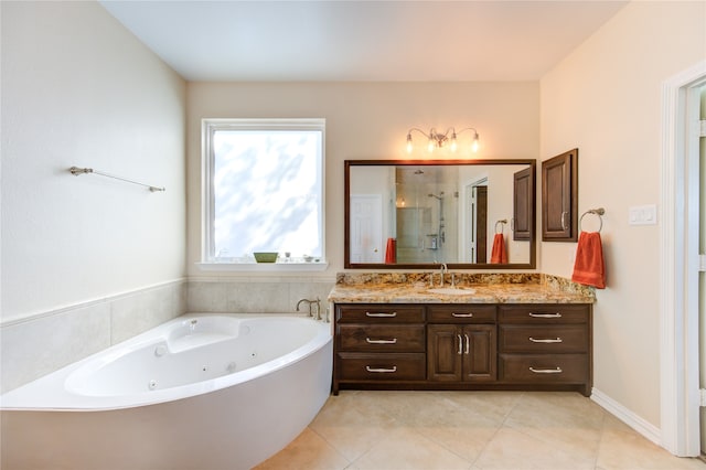 bathroom with tile patterned floors, vanity, and shower with separate bathtub