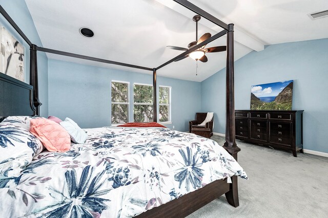 carpeted bedroom with ceiling fan and lofted ceiling with beams