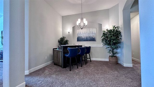 interior space with carpet floors, decorative light fixtures, lofted ceiling, and a notable chandelier