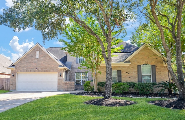 front facade with a front yard and a garage