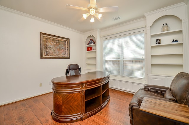 office space with ceiling fan, ornamental molding, and hardwood / wood-style flooring