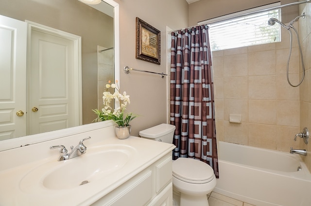 full bathroom featuring tile patterned floors, shower / bath combination with curtain, toilet, and vanity