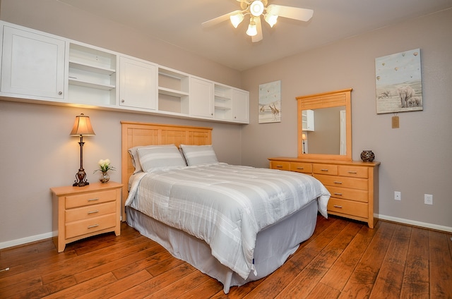 bedroom with ceiling fan and dark hardwood / wood-style flooring