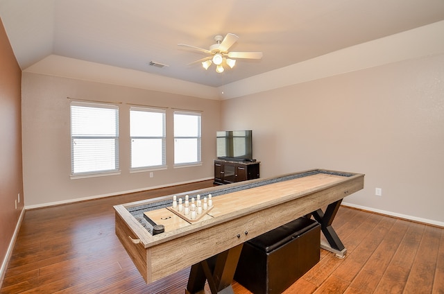 rec room featuring ceiling fan, dark hardwood / wood-style flooring, and vaulted ceiling