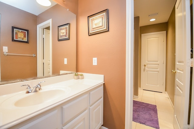 bathroom with tile patterned floors and vanity