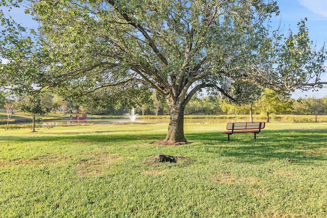 view of home's community featuring a lawn