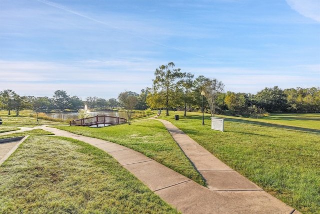 view of property's community with a lawn