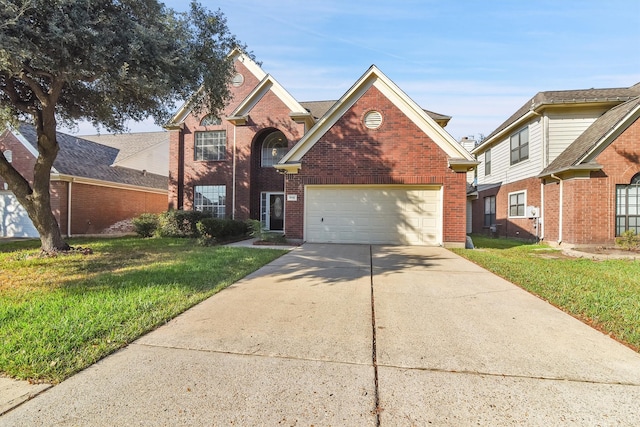 front facade featuring a front yard and a garage