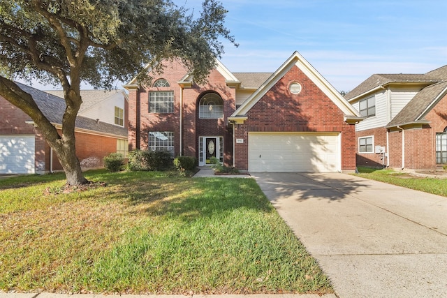 view of front property with a garage and a front lawn