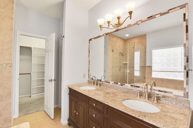 bathroom with tile patterned floors, vanity, and an enclosed shower