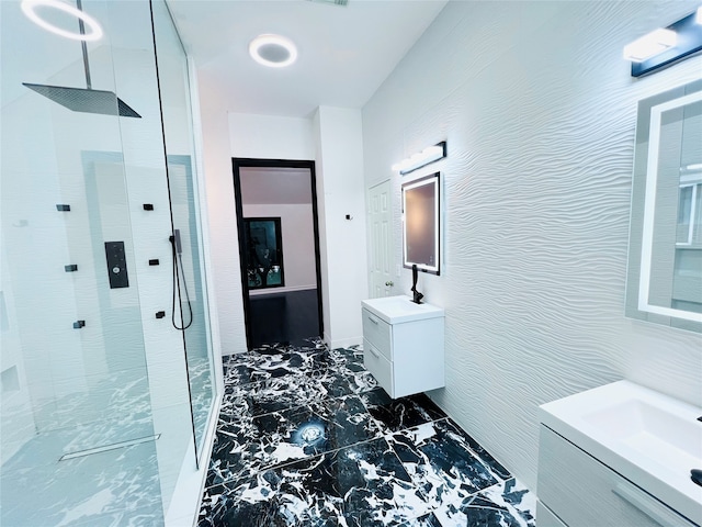 bathroom with vanity and tiled shower