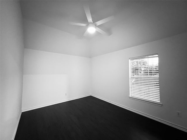 unfurnished room featuring ceiling fan, hardwood / wood-style floors, and vaulted ceiling