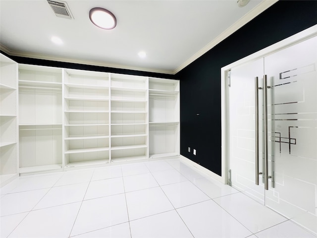 spacious closet with light tile patterned flooring