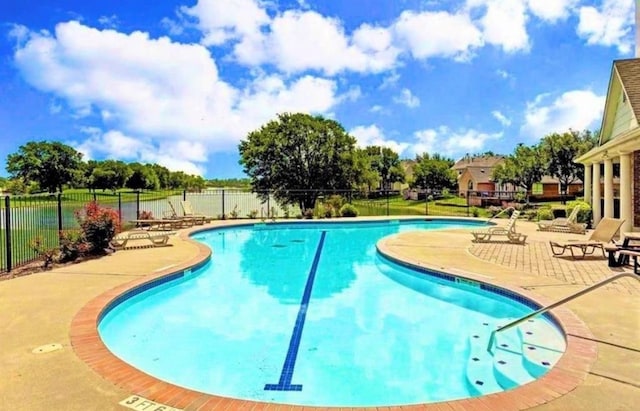 view of pool featuring a patio