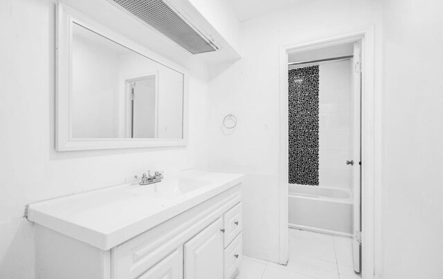 bathroom with vanity and shower / tub combo