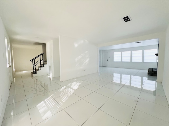 unfurnished room featuring light tile patterned flooring