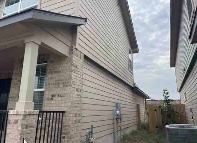 view of property exterior with central AC unit