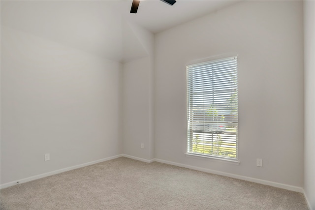 unfurnished room with ceiling fan and light carpet