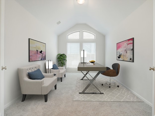 office area featuring light colored carpet and vaulted ceiling