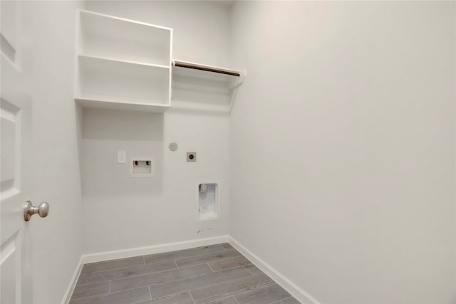 clothes washing area featuring hookup for an electric dryer, washer hookup, and light hardwood / wood-style flooring