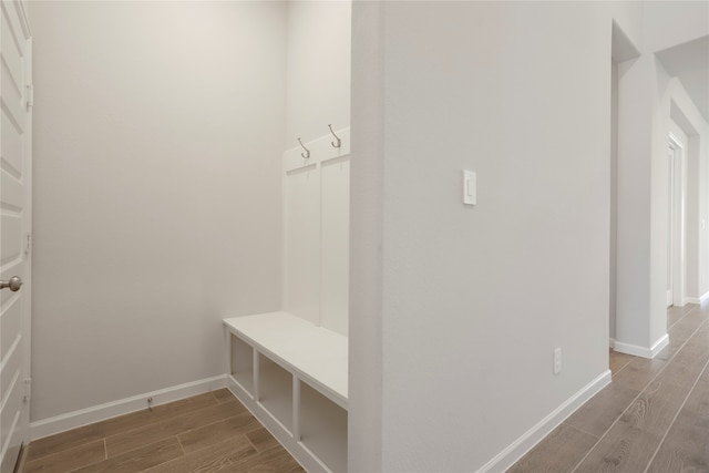 mudroom with wood-type flooring