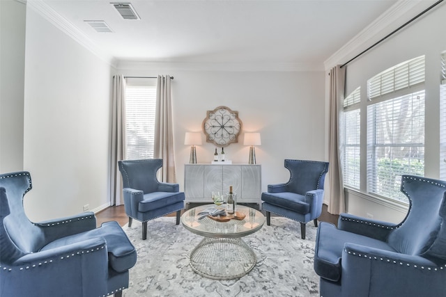 sitting room featuring crown molding and wood-type flooring