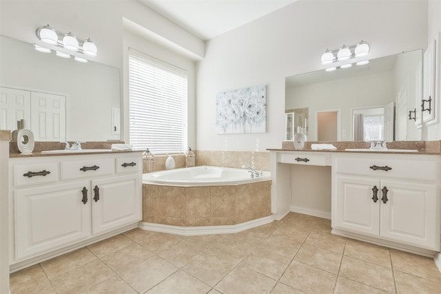 bathroom with independent shower and bath, vanity, and tile patterned floors